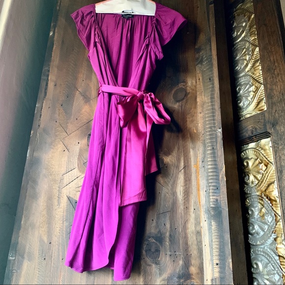 bebe Dresses & Skirts - **SOLD** Meow!  Bebe purple silky wrap  dress